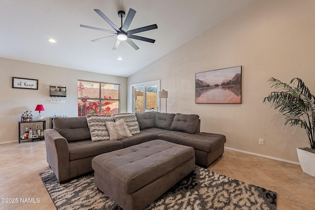 tiled living room with ceiling fan and high vaulted ceiling