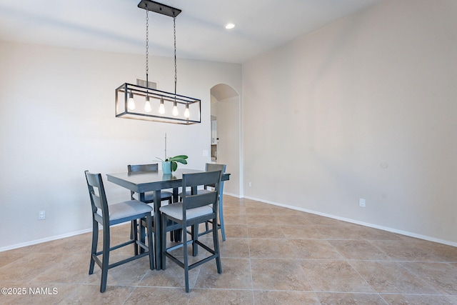 dining area featuring vaulted ceiling