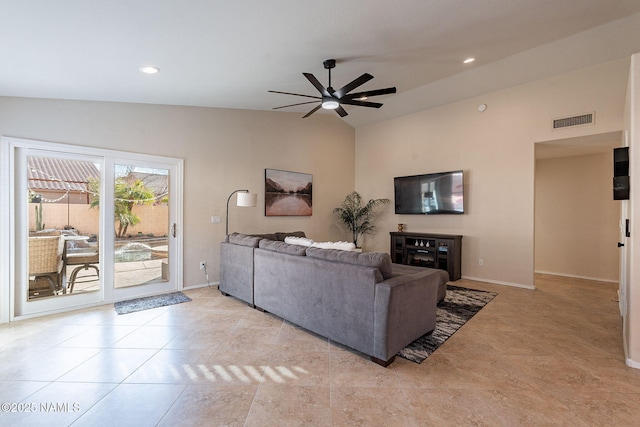 living room with lofted ceiling, light tile patterned floors, and ceiling fan