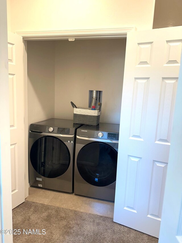 1650 E Ponderosa Pkwy Unit 312, Flagstaff, AZ 86001 - laundry area featuring laundry area, washing machine and dryer, and carpet floors