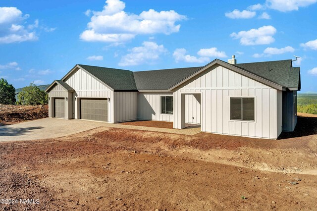 modern farmhouse with a garage