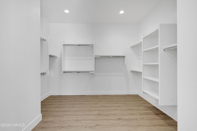 walk in closet featuring light hardwood / wood-style flooring