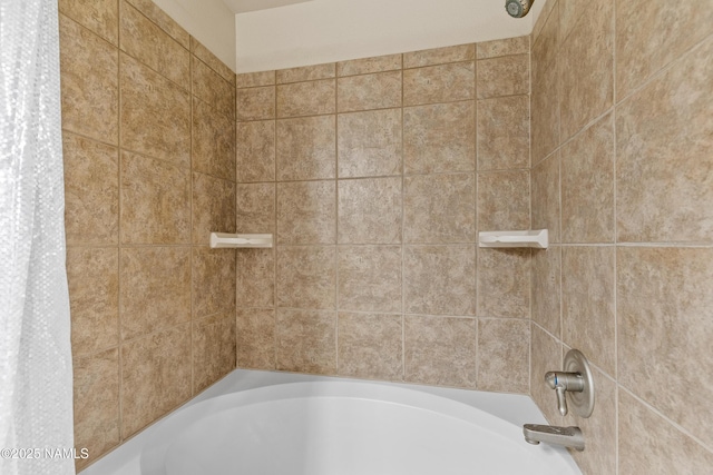 bathroom with shower / bath combo with shower curtain