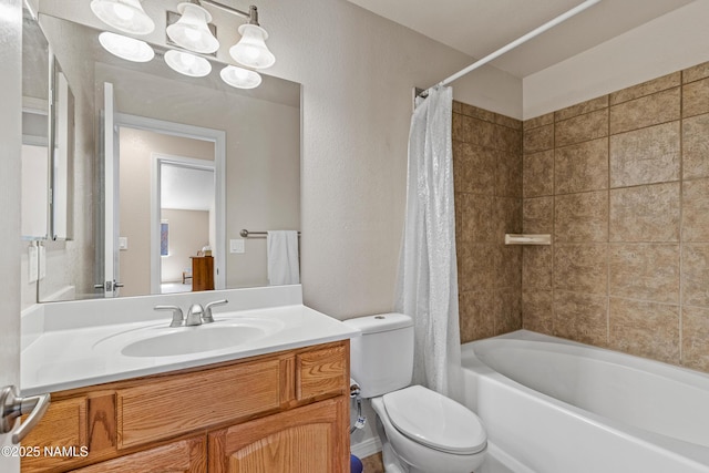 bathroom featuring shower / bath combo, toilet, and vanity