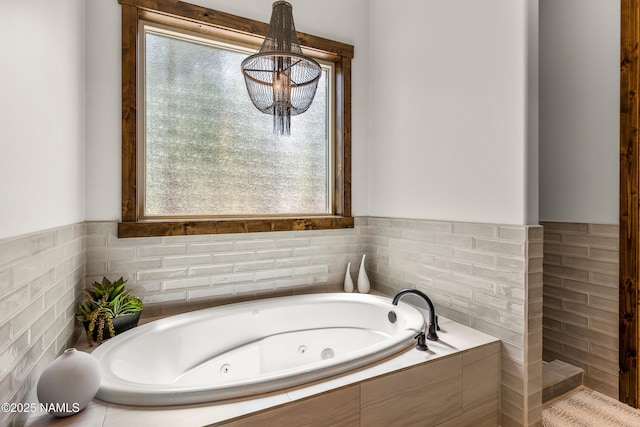 bathroom featuring tiled bath