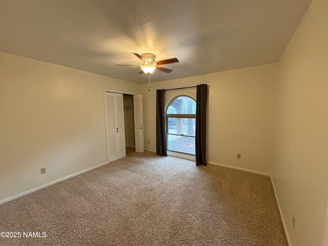 2787 N Pebble Beach Dr, Flagstaff, AZ 86004 - unfurnished bedroom featuring carpet floors, baseboards, a ceiling fan, and a closet