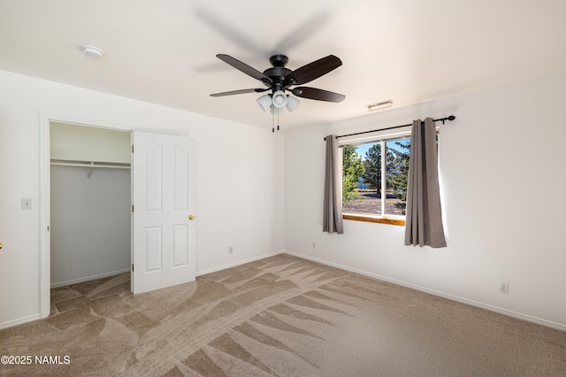 6120 E Treadway Trl, Flagstaff, AZ 86004 - unfurnished bedroom with carpet, baseboards, a closet, and ceiling fan