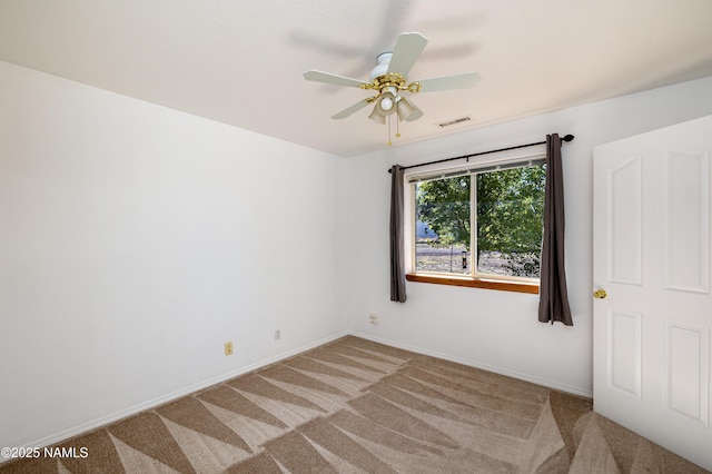 6120 E Treadway Trl, Flagstaff, AZ 86004 - empty room featuring light colored carpet, a ceiling fan, and baseboards