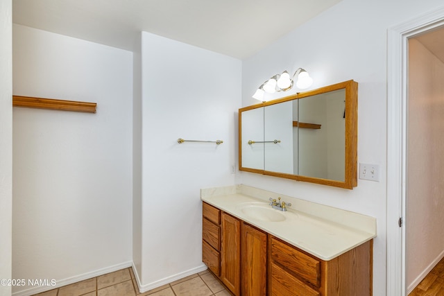 6120 E Treadway Trl, Flagstaff, AZ 86004 - bathroom featuring vanity, baseboards, and tile patterned flooring