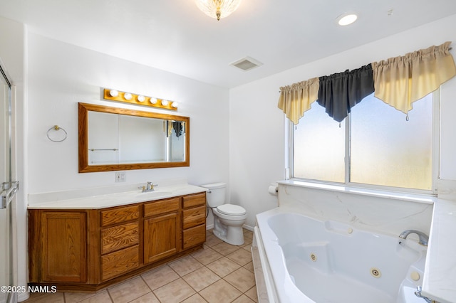 6120 E Treadway Trl, Flagstaff, AZ 86004 - bathroom with a tub with jets, toilet, tile patterned flooring, and vanity
