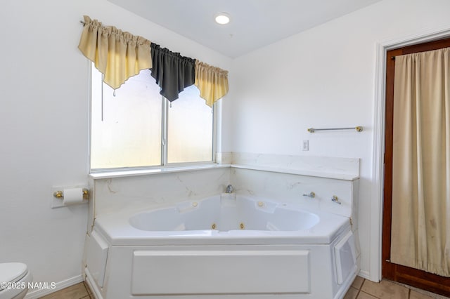 6120 E Treadway Trl, Flagstaff, AZ 86004 - bathroom with a jetted tub, toilet, tile patterned floors, and baseboards