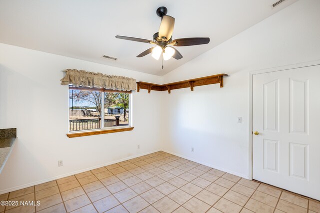 6120 E Treadway Trl, Flagstaff, AZ 86004 - empty room featuring lofted ceiling, ceiling fan, light tile patterned floors, and baseboards
