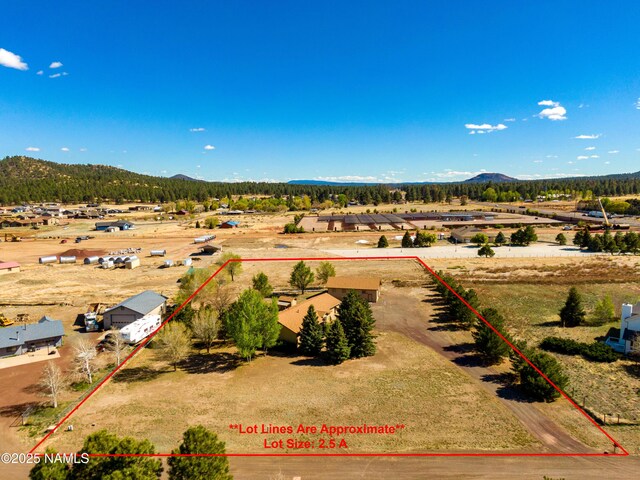 6120 E Treadway Trl, Flagstaff, AZ 86004 - aerial view of property and surrounding area featuring mountains and property parcel outlined