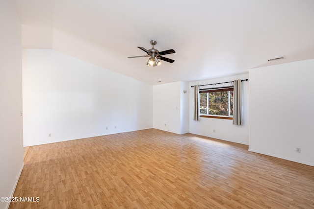 6120 E Treadway Trl, Flagstaff, AZ 86004 - unfurnished room with light wood-style floors, a ceiling fan, and baseboards