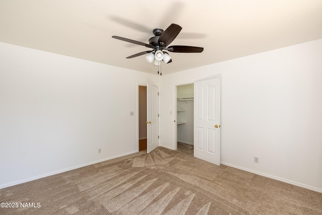 6120 E Treadway Trl, Flagstaff, AZ 86004 - unfurnished bedroom featuring light carpet, baseboards, a ceiling fan, and a closet