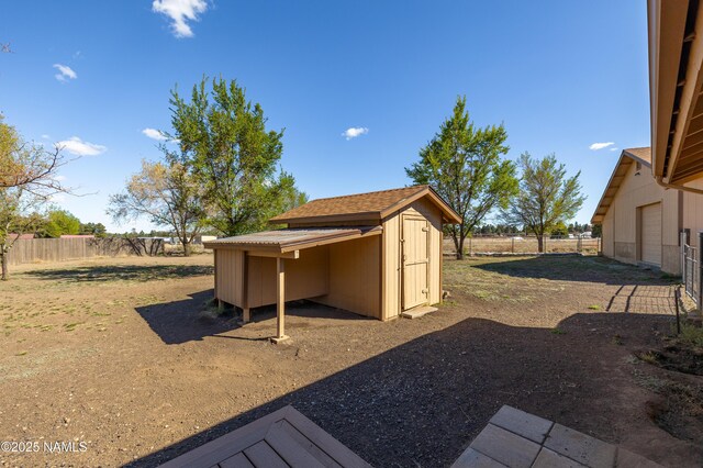 6120 E Treadway Trl, Flagstaff, AZ 86004 - view of yard with fence, an outbuilding, and a storage shed