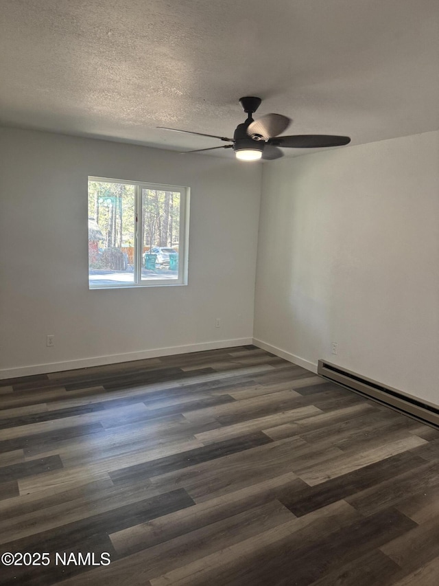 unfurnished room with ceiling fan, dark hardwood / wood-style floors, a textured ceiling, and baseboard heating