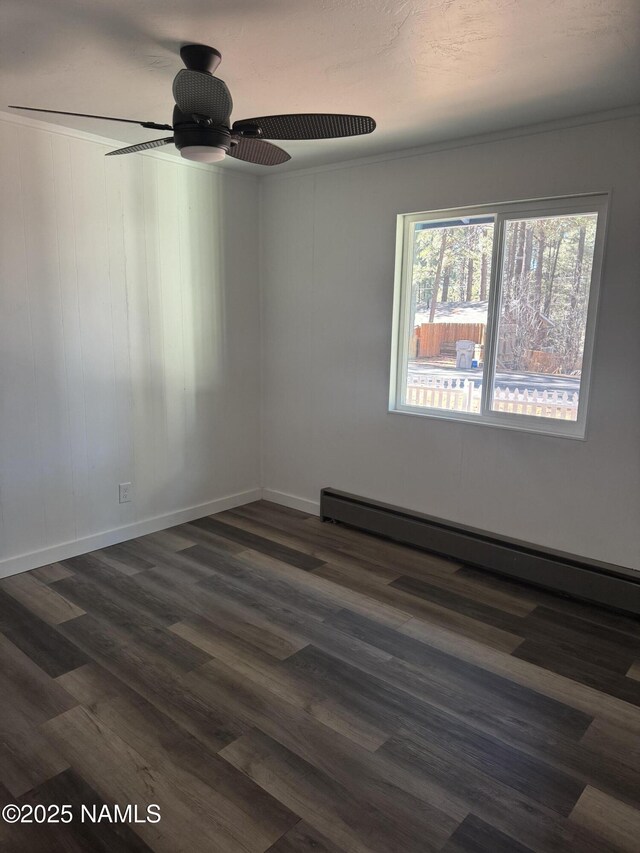 874 Onieda, Flagstaff, AZ 86005 - spare room with ceiling fan, a baseboard radiator, and dark hardwood / wood-style floors