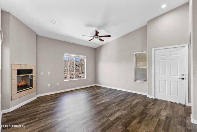 4343 E Soliere Ave Unit 2068, Flagstaff, AZ 86004 - unfurnished living room featuring dark wood finished floors, a ceiling fan, baseboards, and a fireplace