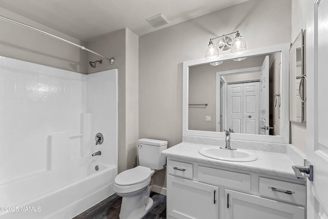 4343 E Soliere Ave Unit 2068, Flagstaff, AZ 86004 - full bath with visible vents, toilet, wood finished floors, bathtub / shower combination, and vanity