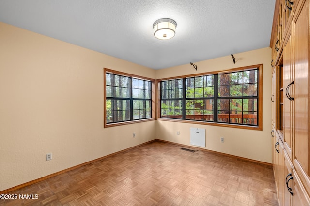 3130 Tina Ln, Flagstaff, AZ 86001 - unfurnished room with baseboards and a textured ceiling