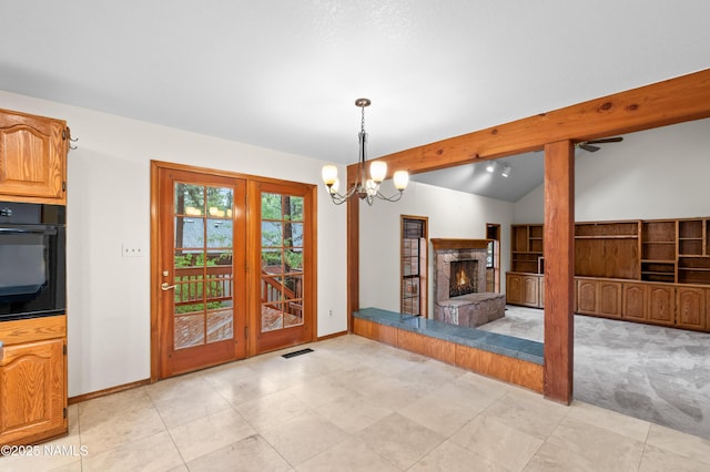 3130 Tina Ln, Flagstaff, AZ 86001 - unfurnished dining area with a stone fireplace and a chandelier