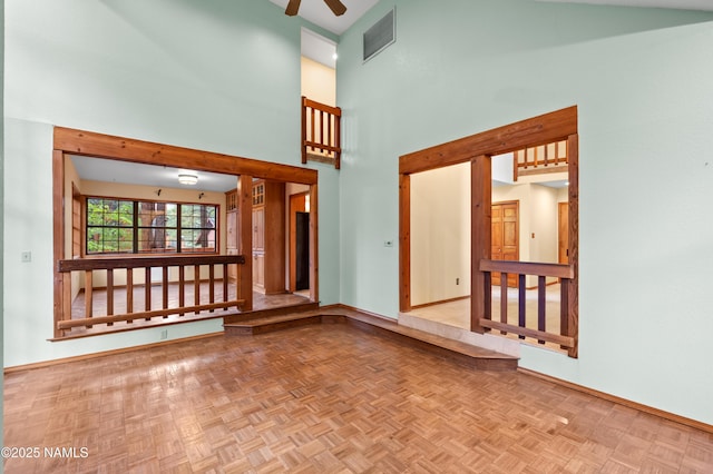 3130 Tina Ln, Flagstaff, AZ 86001 - empty room featuring a ceiling fan and a towering ceiling