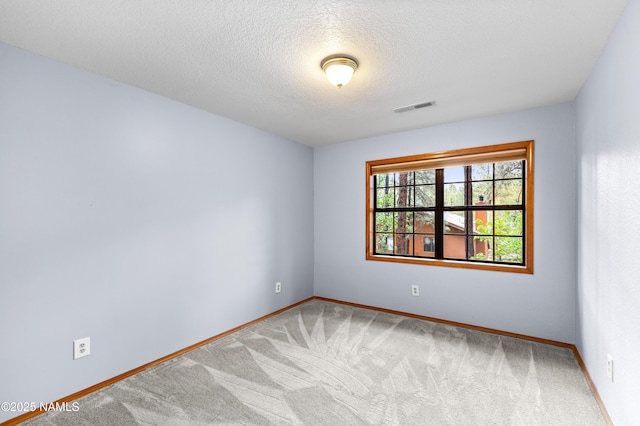 3130 Tina Ln, Flagstaff, AZ 86001 - carpeted spare room featuring baseboards and a textured ceiling