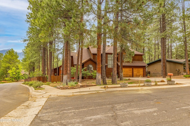 3130 Tina Ln, Flagstaff, AZ 86001 - chalet / cabin with driveway and a garage