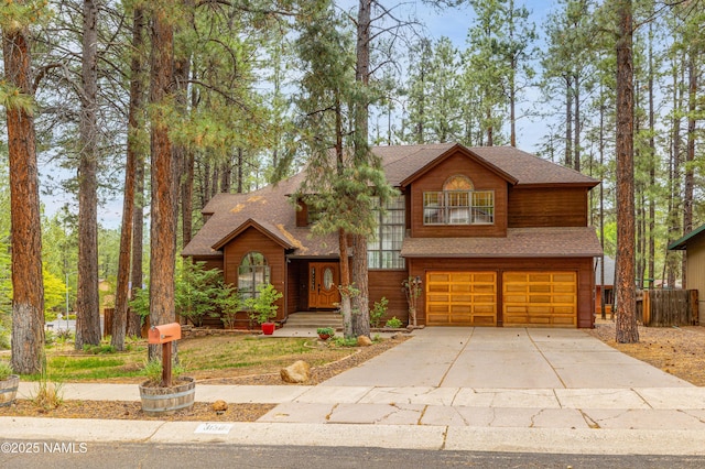 3130 Tina Ln, Flagstaff, AZ 86001 - rustic home with a garage, roof with shingles, and concrete driveway