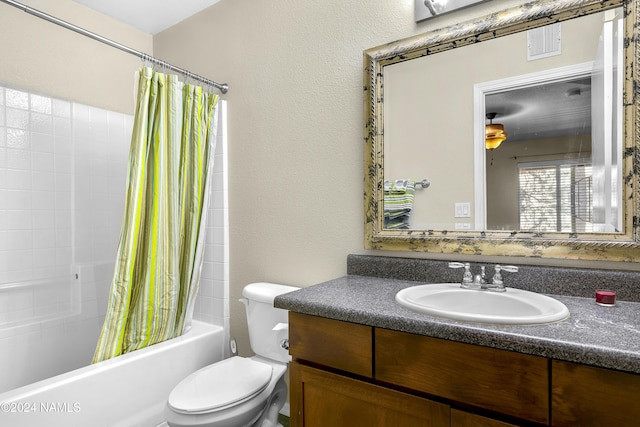 full bathroom with shower / bath combo with shower curtain, toilet, and vanity