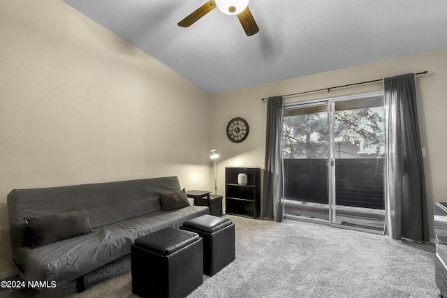 carpeted living room with ceiling fan, a textured ceiling, and lofted ceiling