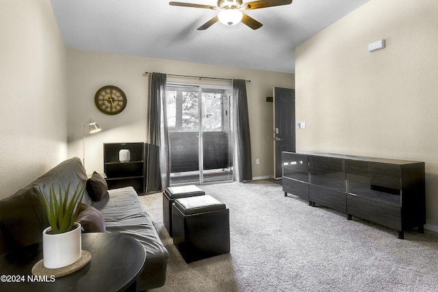 living room featuring ceiling fan and carpet