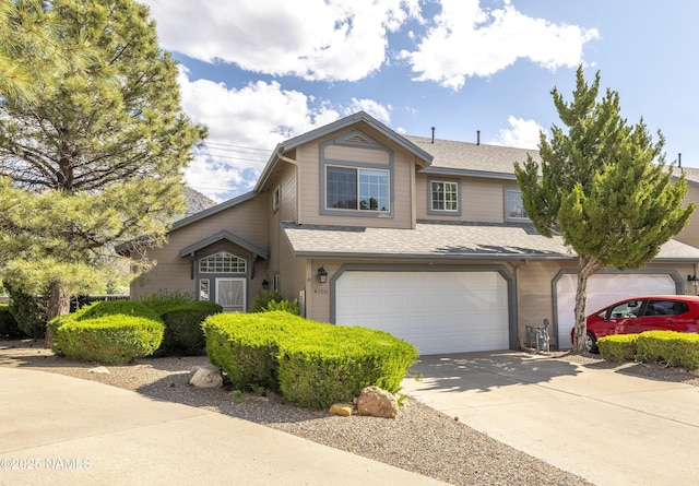 4100 E Village Cir, Flagstaff, AZ 86004 - traditional-style home featuring a garage, driveway, and a shingled roof
