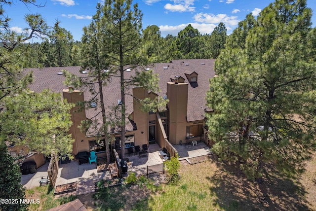 2315 N Whispering Pines Way, Flagstaff, AZ 86004 - aerial view of property and surrounding area featuring a heavily wooded area