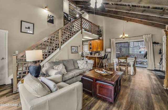 2929 Kletha Trl, Flagstaff, AZ 86005 - living room featuring stairs, a chandelier, dark wood-type flooring, beamed ceiling, and high vaulted ceiling