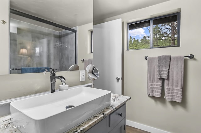 2929 Kletha Trl, Flagstaff, AZ 86005 - bathroom with vanity, wood finished floors, and baseboards
