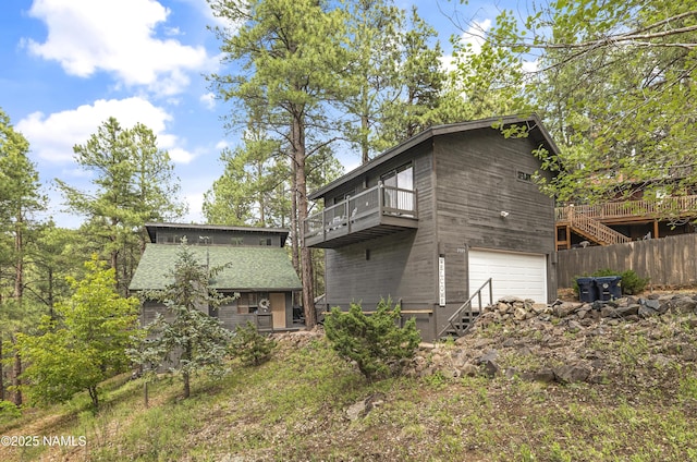 2929 Kletha Trl, Flagstaff, AZ 86005 - back of property featuring an attached garage and stairs