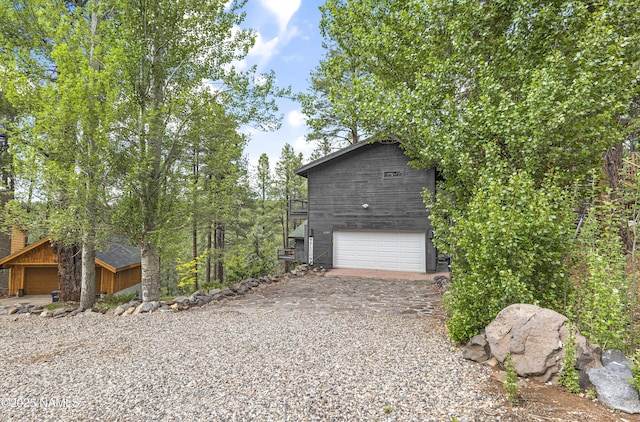 2929 Kletha Trl, Flagstaff, AZ 86005 - view of home's exterior with driveway and an attached garage