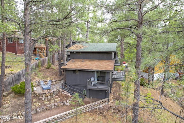 2929 Kletha Trl, Flagstaff, AZ 86005 - back of house featuring a shingled roof and a deck