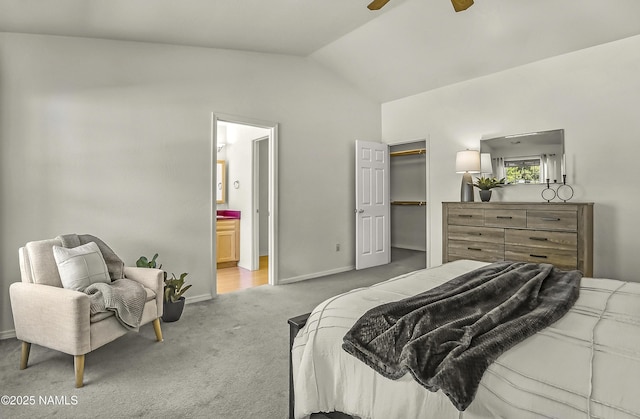 8210 Winchester Dr, Flagstaff, AZ 86004 - carpeted bedroom featuring lofted ceiling, ensuite bath, baseboards, a walk in closet, and a closet