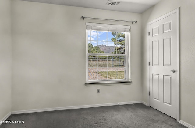 8210 Winchester Dr, Flagstaff, AZ 86004 - spare room featuring dark colored carpet and baseboards