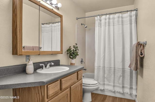 8210 Winchester Dr, Flagstaff, AZ 86004 - bathroom with shower / bathtub combination with curtain, toilet, vanity, and wood finished floors