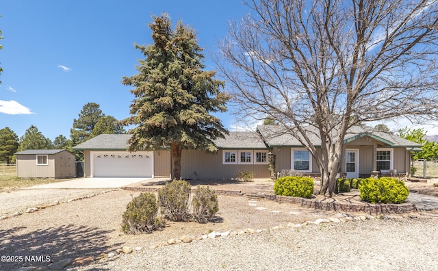 8210 Winchester Dr, Flagstaff, AZ 86004 - single story home with driveway, fence, an attached garage, a storage shed, and an outdoor structure