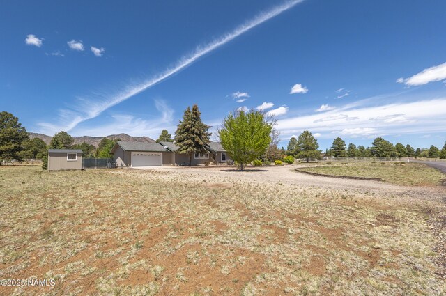 8210 Winchester Dr, Flagstaff, AZ 86004 - view of yard featuring fence and an attached garage