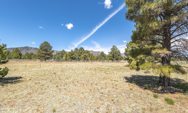 8210 Winchester Dr, Flagstaff, AZ 86004 - view of yard featuring a mountain view, a view of rural / pastoral area, and fence