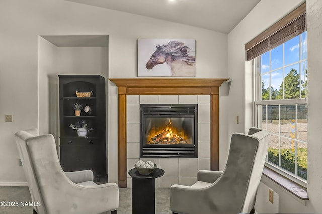 8210 Winchester Dr, Flagstaff, AZ 86004 - living area featuring a tile fireplace and vaulted ceiling