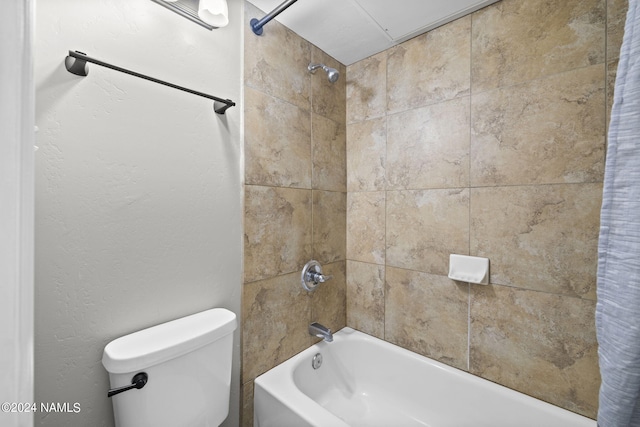 bathroom featuring toilet and shower / bath combo