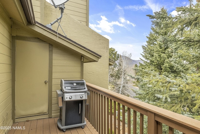deck with a mountain view and a grill