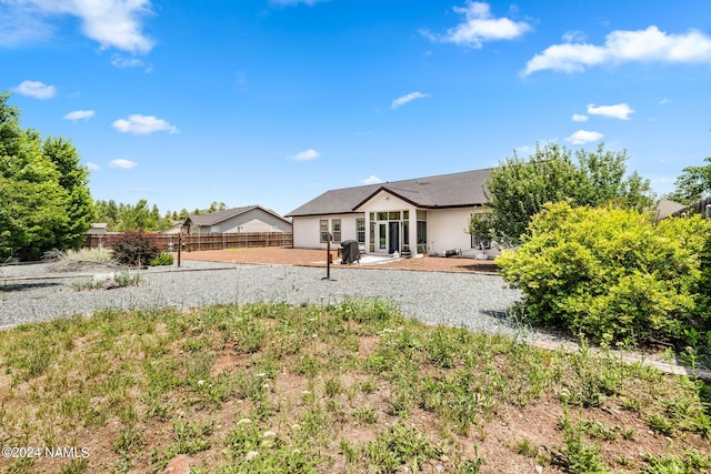 back of property with a patio area